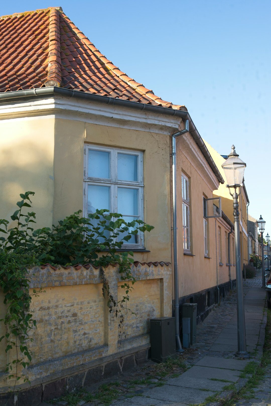 Photographer talking with local Danish residents in a small town
