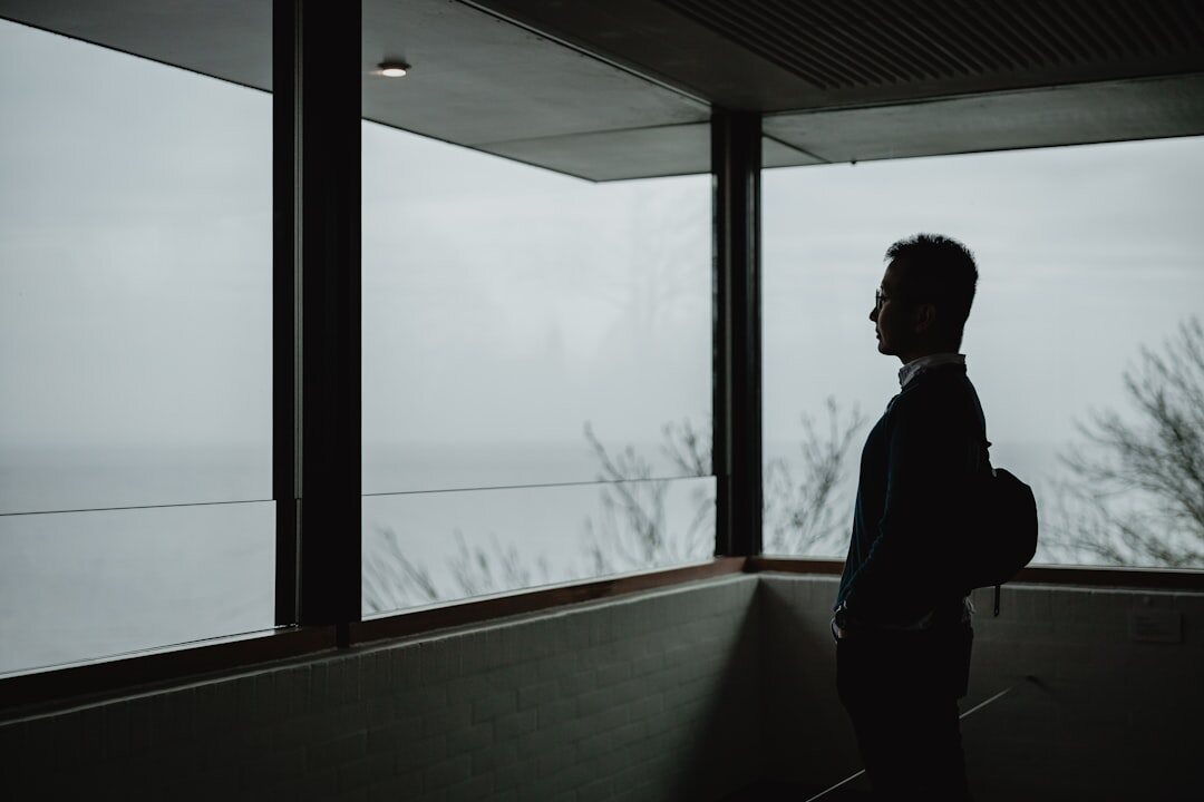 Portrait of a Danish documentary photographer holding a camera